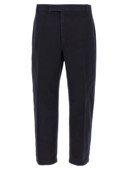 Trousers by Thom Browne for men in cotton blue presents a perennial silhouette, meticulously tailored with a straight-leg cut, long finish, and an elegant .