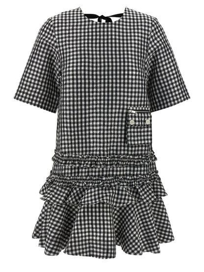 Dress by Ganni for women in polyester bicolour, black & white features an cute silhouette, detailed with a short-sleeve and round neckline that elegantly flows into a cute short mini.