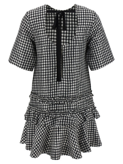 Dress by Ganni for women in polyester bicolour, black & white features an sultry silhouette defined by a round neckline and , falling to an sultry short mini for a sultry look.