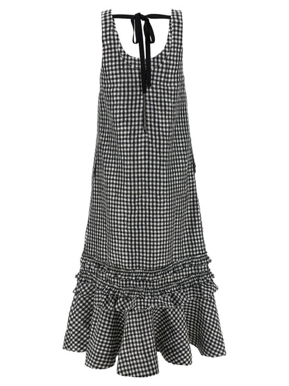 Dress by Ganni for women in polyester black features an sultry silhouette defined by a round neckline and , falling to an sultry midi long for a sultry look.