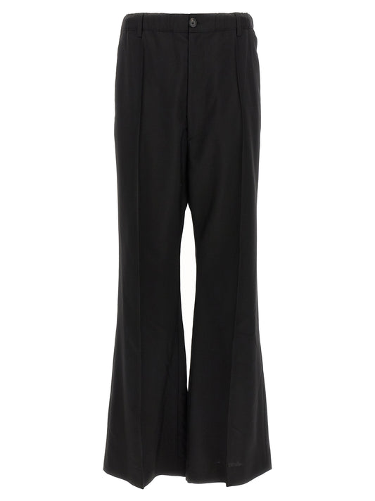 Trousers by Marni for men in virgin wool black & signature presents a perennial silhouette, meticulously tailored with a wide cut, long finish, and an elegant high rise.