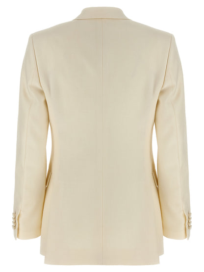 This Blazer by Brioni for women in linen silk & wool white, patterned & herringbone presents a tailored silhouette, meticulously tailored with a tailored and distinctive for a tailored finish.