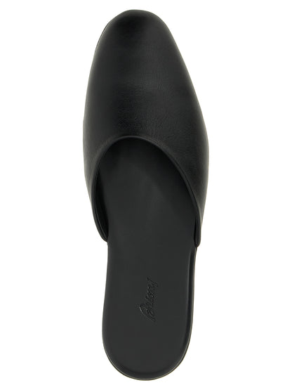 Mules Flat Shoes by Brioni for women in calfskin leather black presents a effortless chic silhouette, showcasing the Women's Calfskin Leather Mules Flat Shoes design with a effortless chic and for a sophisticated look.