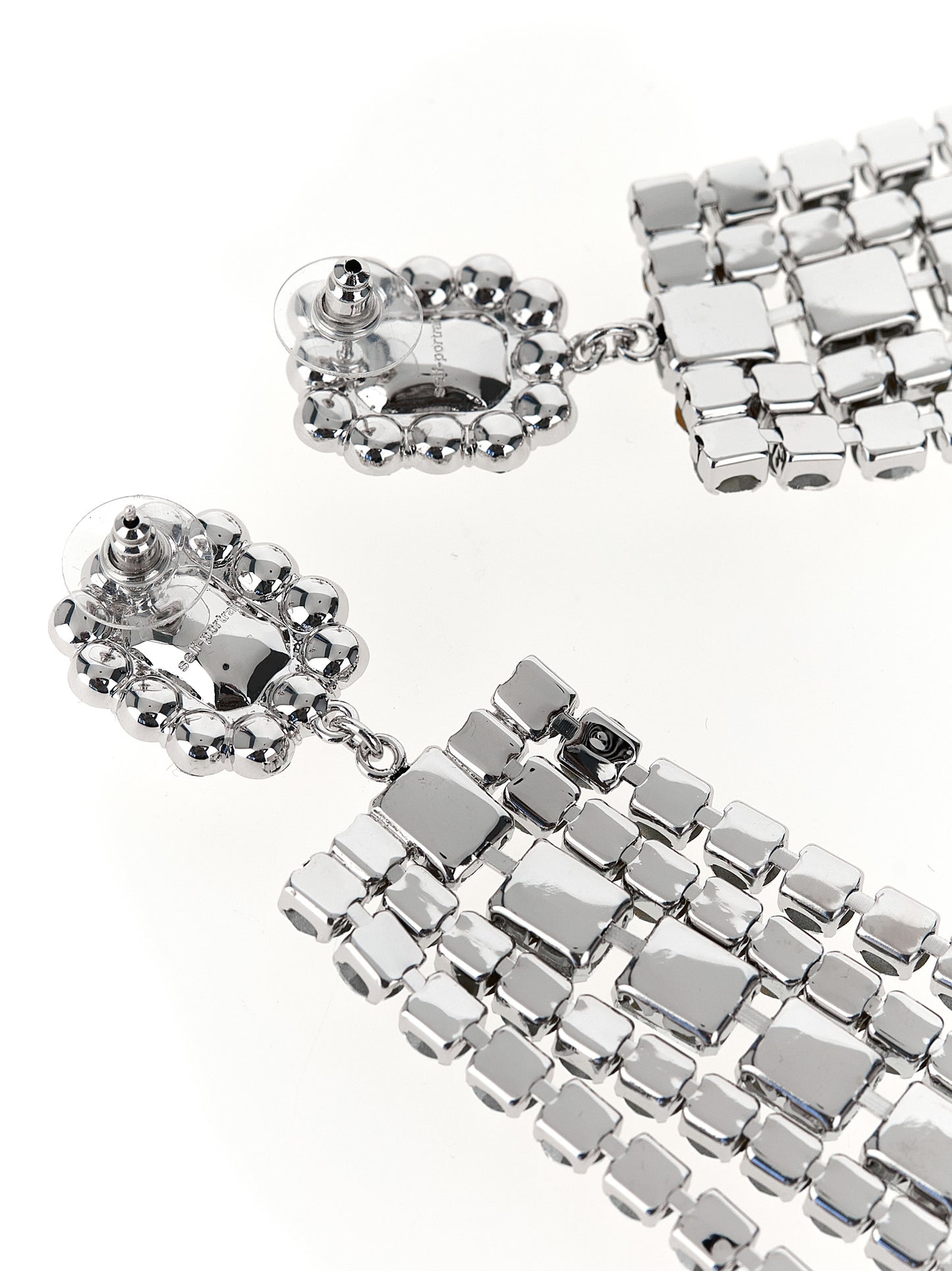 Earrings by Self-Portrait for women in virgin wool silver presents a curated silhouette, artfully showcasing the curated and refined aesthetic of the Women's Silver Brass Crystal & Cotton Earrings.