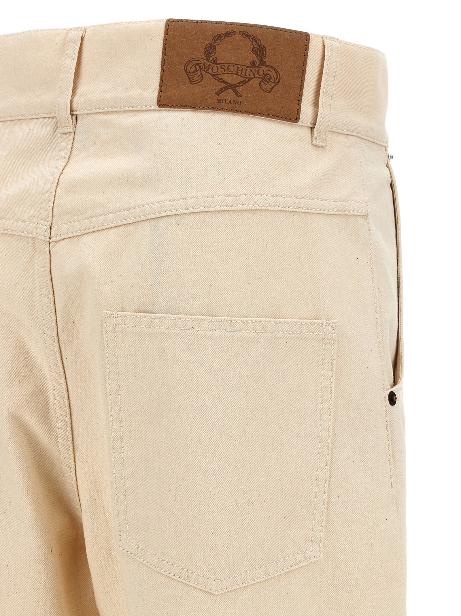 Chinos Pants by Moschino for women in leather & cotton beige features an utilitarian-chic silhouette, showcasing a utilitarian-chic with a long cut and for a refined look.