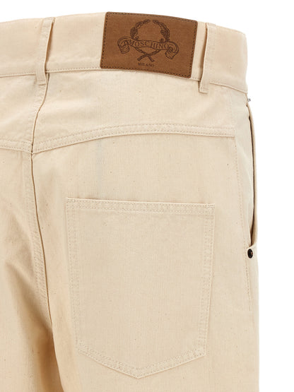 Chinos Pants by Moschino for women in leather & cotton beige features an utilitarian-chic silhouette, showcasing a utilitarian-chic with a long cut and for a refined look.