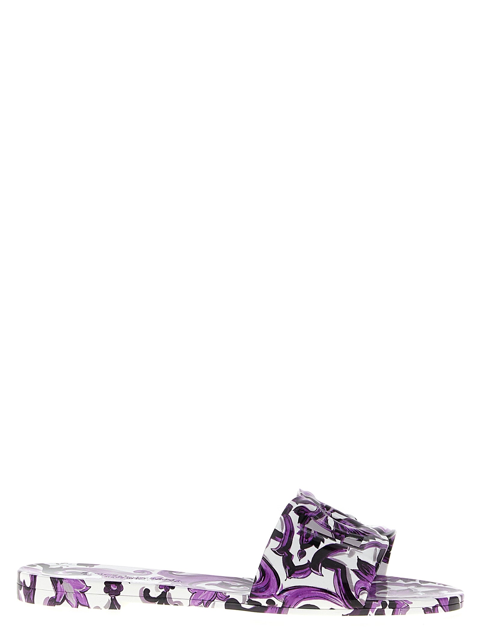 Sliders Flat Shoes by Dolce & Gabbana for women in thermoplastic polyurethane purple & print showcases a resplendent Maiolica Women's Thermoplastic Polyurethane Sliders Flat Shoes aesthetic with a and .