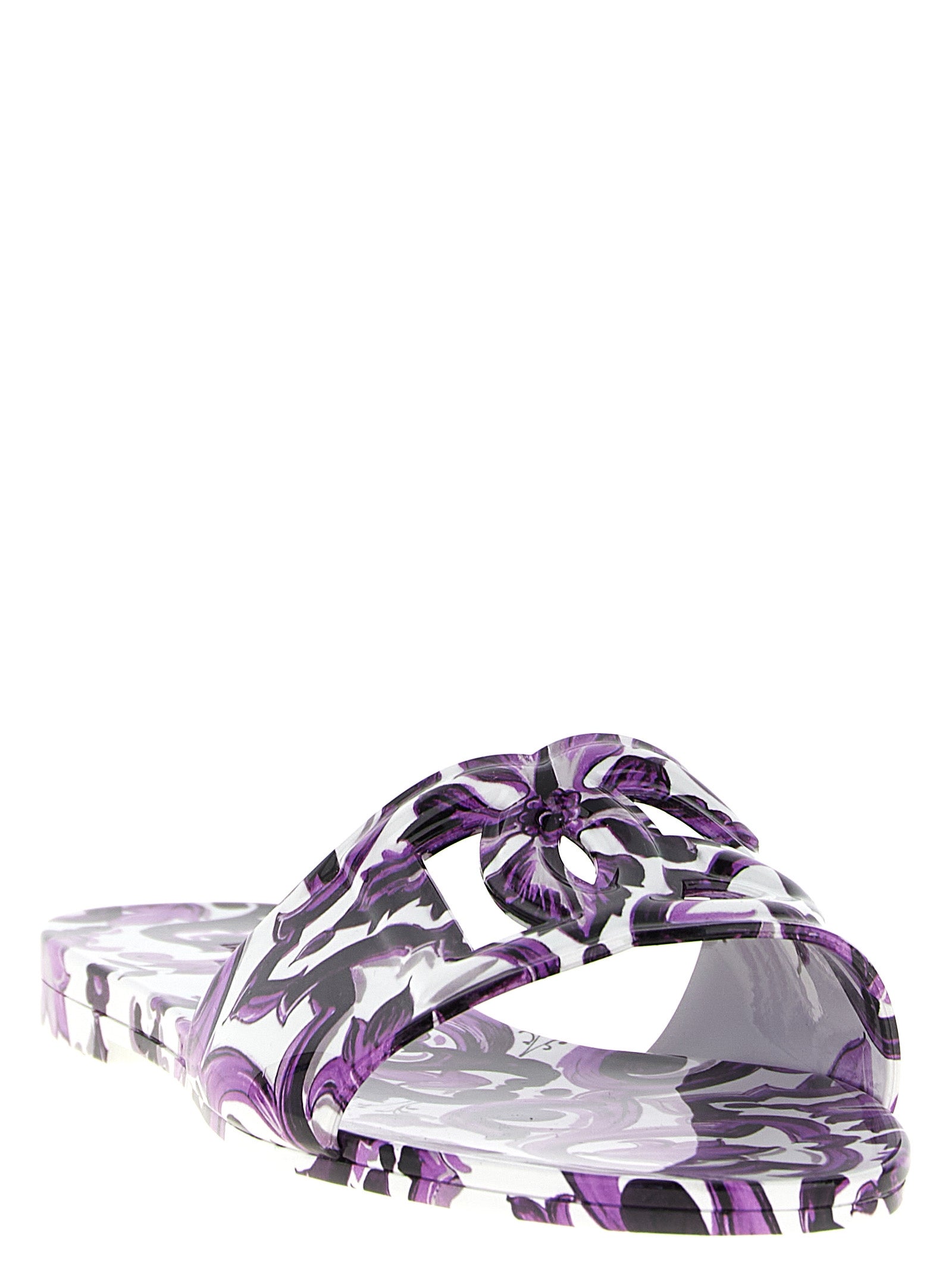 Sliders Flat Shoes by Dolce & Gabbana for women in thermoplastic polyurethane purple & print showcases a enchanting silhouette as part of the Maiolica Women's Thermoplastic Polyurethane Sliders Flat Shoes collection, defined by a enchanting and for a enchanting look.