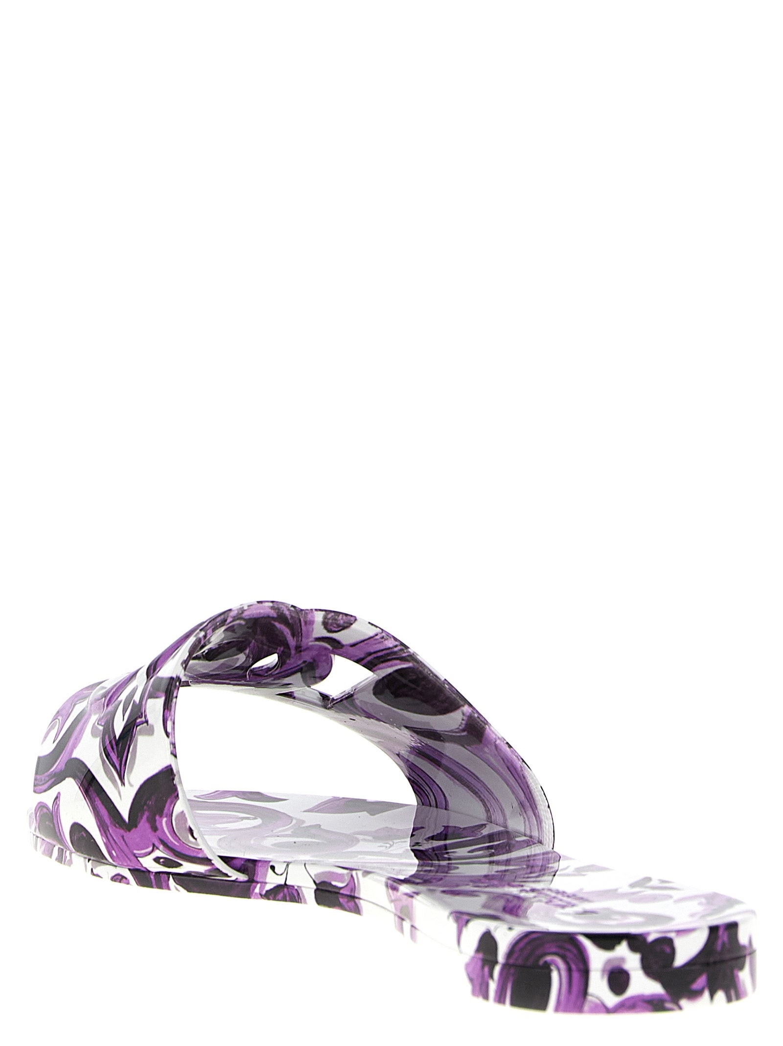 Sliders Flat Shoes by Dolce & Gabbana for women in thermoplastic polyurethane purple & print showcases a dynamic silhouette, artfully capturing Maiolica Women's Thermoplastic Polyurethane Sliders Flat Shoes through its distinctive and elegant .