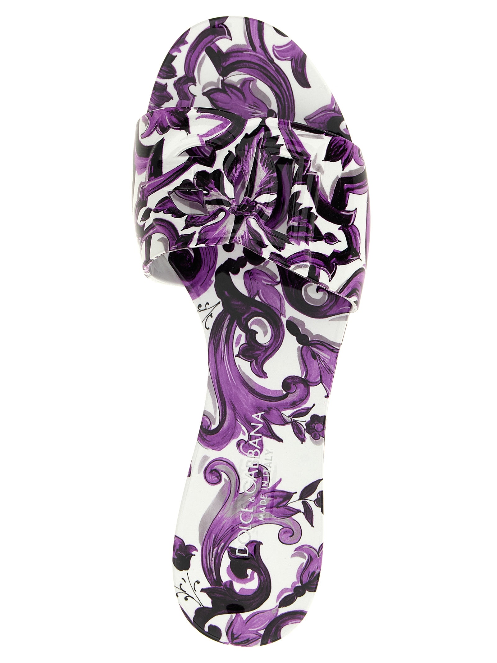 Sliders Flat Shoes by Dolce & Gabbana for women in thermoplastic polyurethane purple & print presents a effortless chic silhouette, showcasing the Maiolica Women's Thermoplastic Polyurethane Sliders Flat Shoes design with a effortless chic and for a sophisticated look.