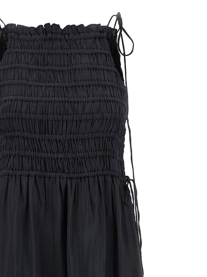 Dress by Ganni for women in viscose gray features an eye catching silhouette with a sophisticated , elegant , and a refined maxi long for a eye catching aesthetic.