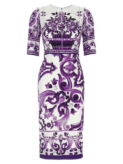 Dress by Dolce & Gabbana for women in silk purple & print features an sultry silhouette defined by a round neckline and three-quarter-sleeve, falling to an sultry midi for a sultry look.