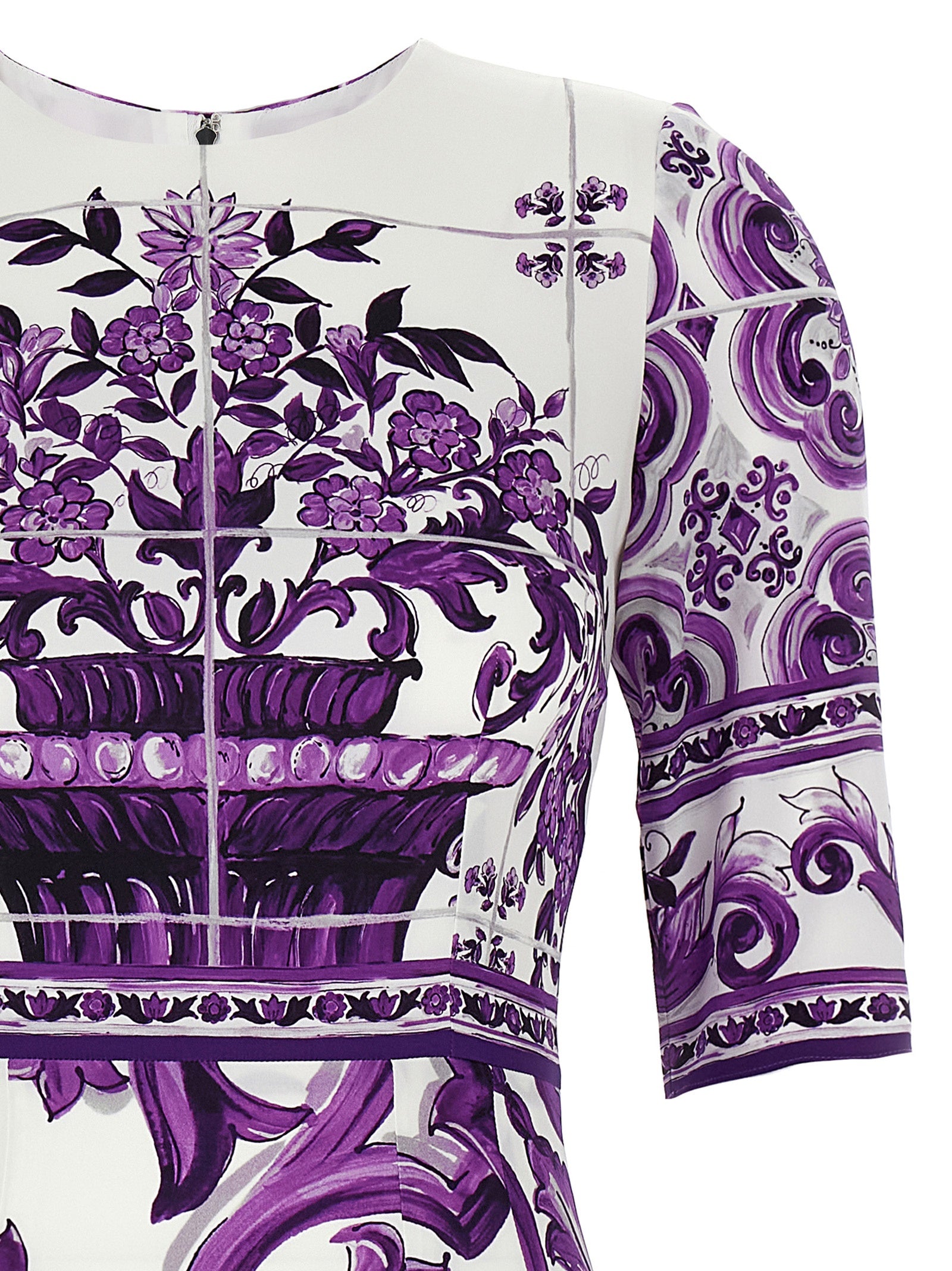 Dress by Dolce & Gabbana for women in silk purple & print features an cute silhouette, detailed with a and round neckline that elegantly flows into a cute midi.
