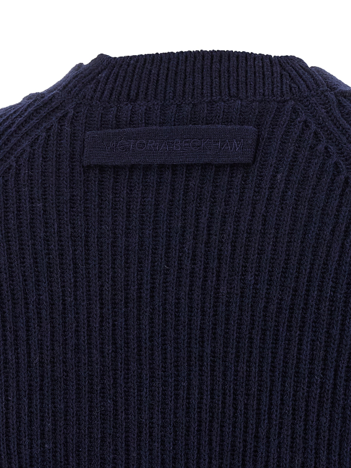 Cardigan by Victoria Beckham for women in cashmere blue showcases a captivating silhouette, artfully detailed with a captivating and for a truly sophisticated captivating look.