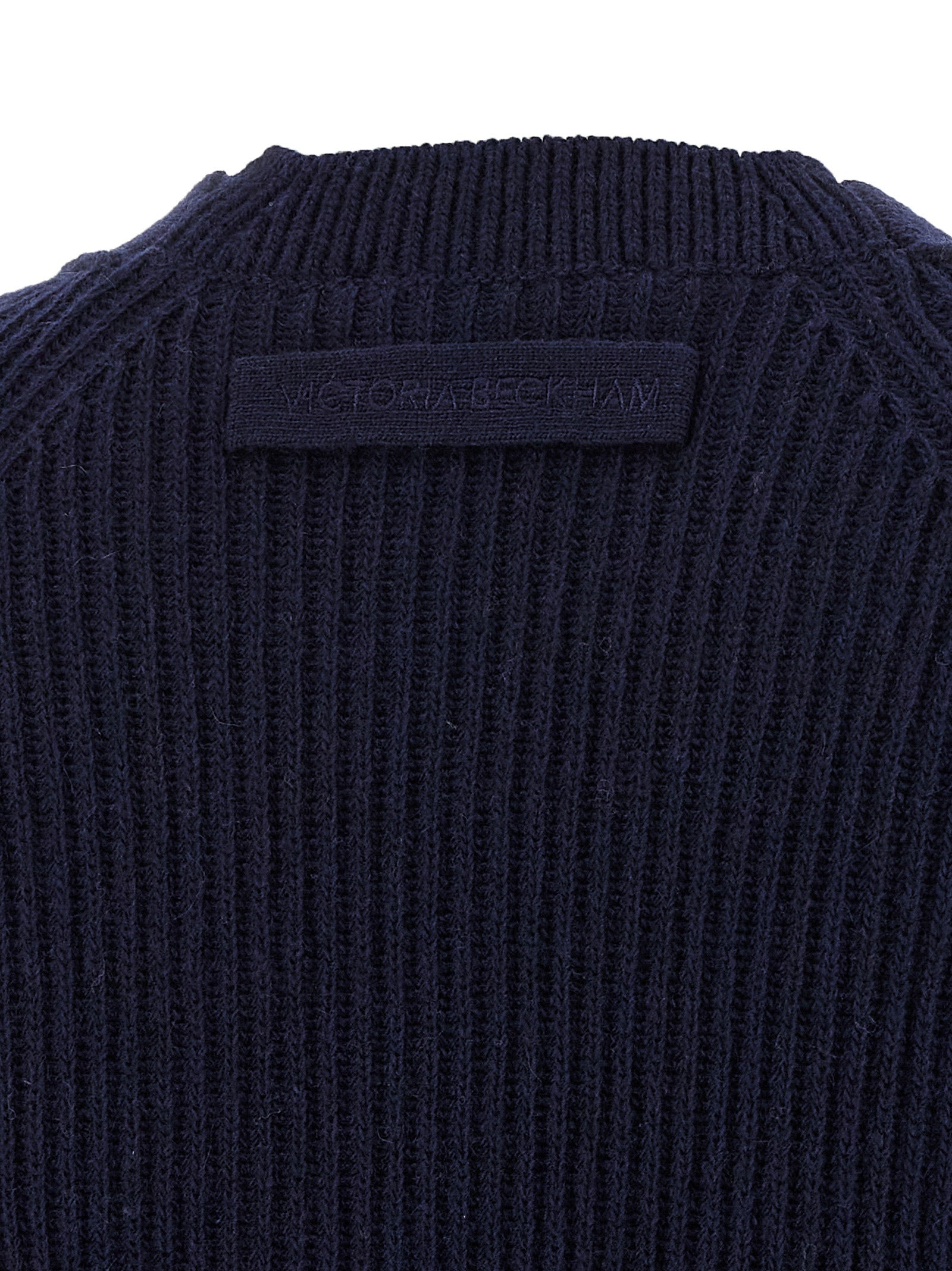 Cardigan by Victoria Beckham for women in cashmere blue showcases a captivating silhouette, artfully detailed with a captivating and for a truly sophisticated captivating look.