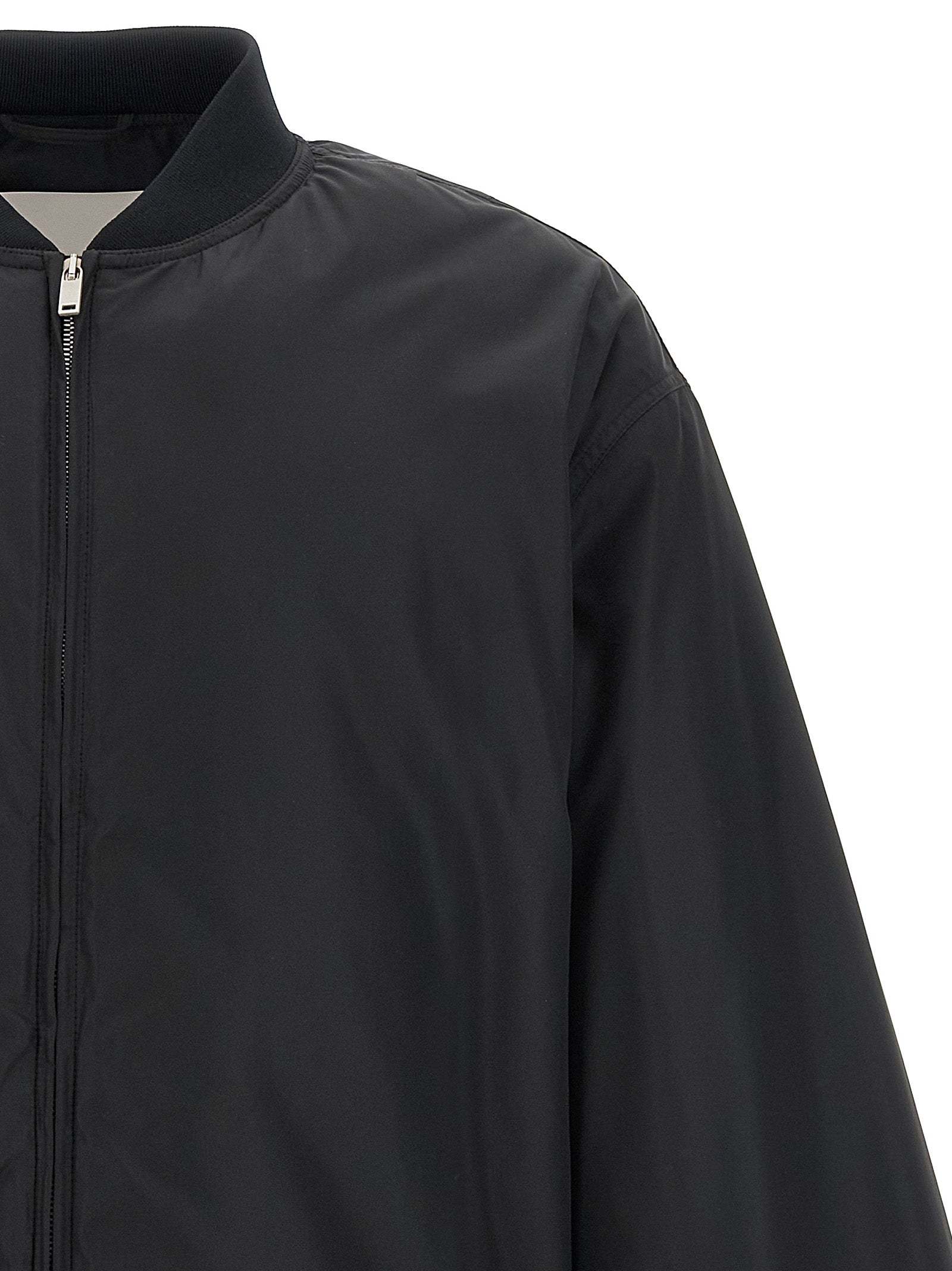 Bomber Jacket by Jil Sander for men in polyester & goose down black presents a effortlessly chic silhouette, showcasing a sophisticated and premium pockets & insulated for a truly effortlessly chic finish.