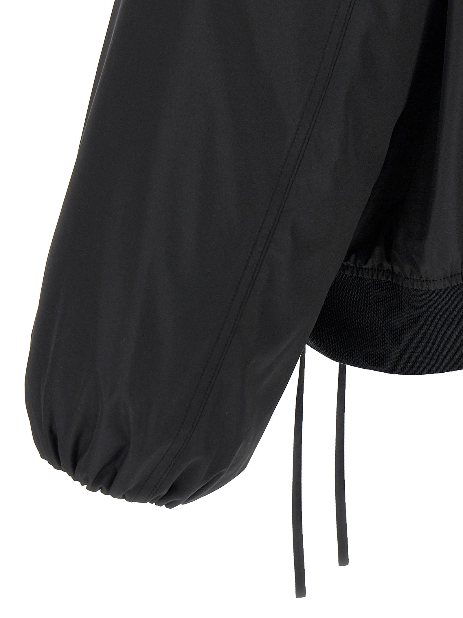 Bomber Jacket by Jil Sander for men in polyester & goose down black features an contemporary silhouette, showcasing a sophisticated and contemporary pockets & insulated for a truly refined look.
