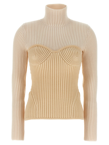 Top by Jean Paul Gaultier for women in merino wool beige showcases a chic silhouette, artfully detailed with a chic high-neck neckline and long-sleeve for a sophisticated, chic finish.