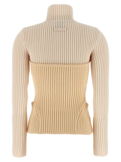 Top by Jean Paul Gaultier for women in merino wool beige showcases a sublime silhouette, detailed with a sublime and high-neck neckline for a sophisticated finish.