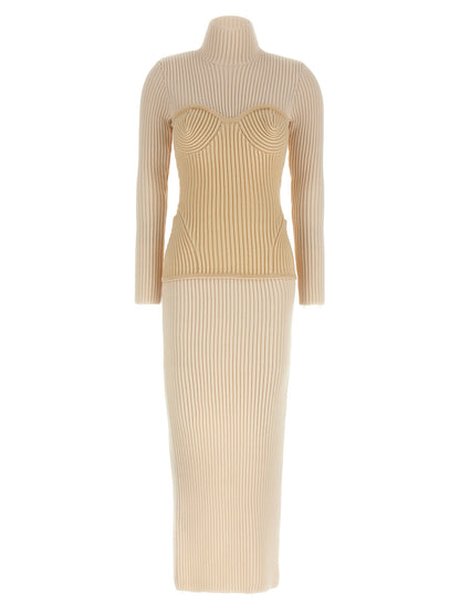 Dress by Jean Paul Gaultier for women in merino wool beige features an eye catching silhouette with a sophisticated split high-neck neckline, elegant long-sleeve, and a refined long for a eye catching aesthetic.