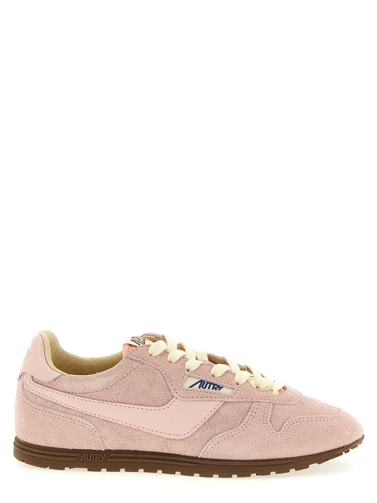 Sneakers by Autry for women in nylon cotton terry & suede cowhide leather multicolor, pink & jacquard presents a on trend silhouette from the Women's Low Top Nylon Cotton Terry & Suede Cowhide Leather Sneakers collection, showcasing a on trend low-top style for an elevated aesthetic.