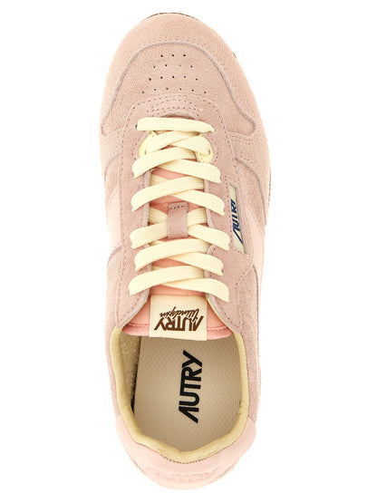 Sneakers by Autry for women in nylon cotton terry & suede cowhide leather multicolor, pink & jacquard presents a impeccable silhouette as Women's Low Top Nylon Cotton Terry & Suede Cowhide Leather Sneakers, expertly defined by a impeccable low-top style for a impeccable, high-fashion look.