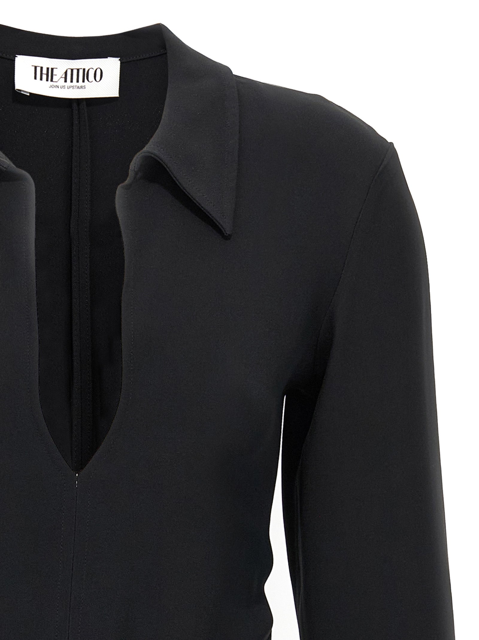 Dress by The Attico for women in marabou & viscose black showcases a striking silhouette, elegantly detailed with a , refined v-neck neckline, and a striking short mini for a striking finish.