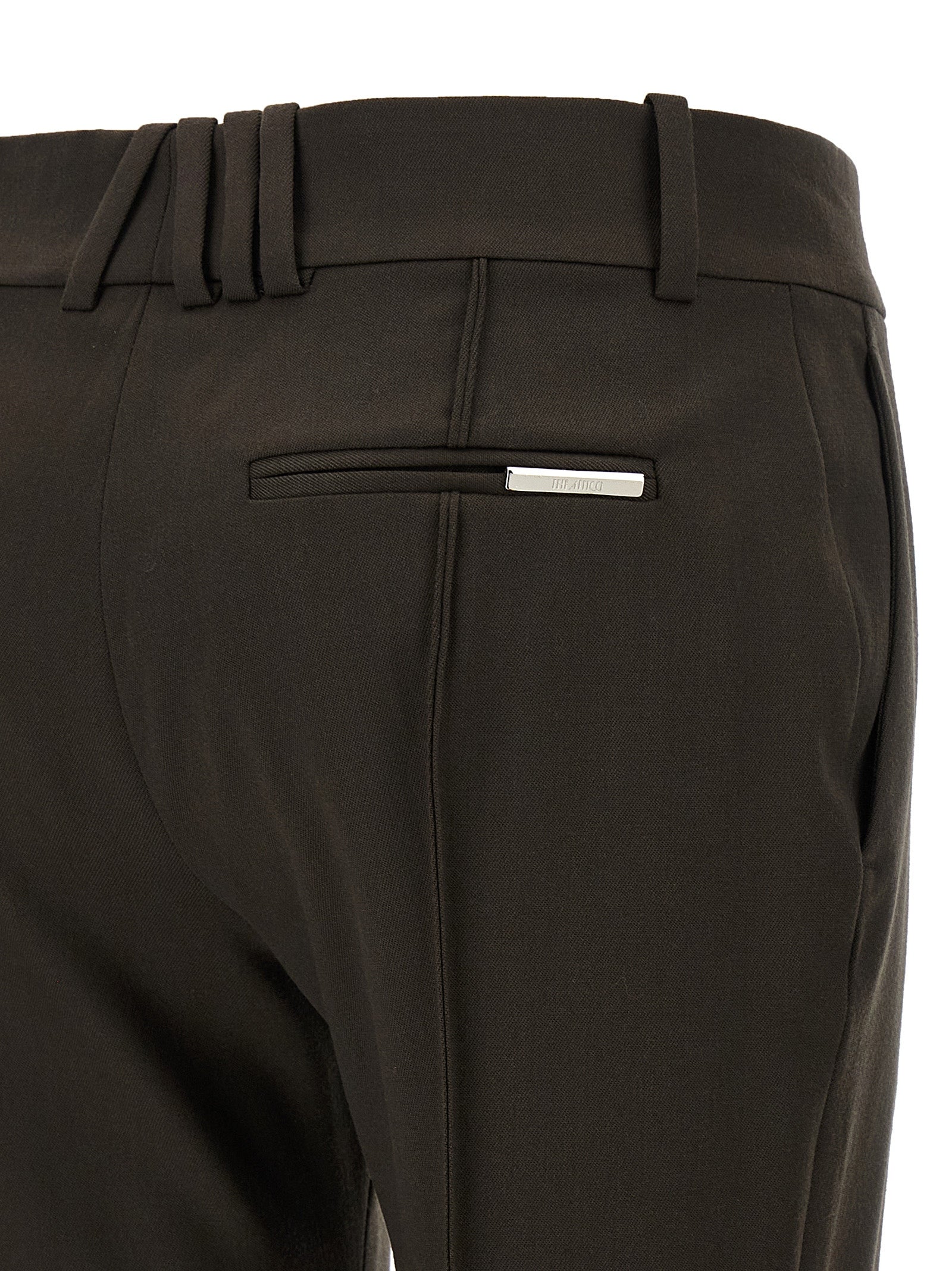 Trousers by The Attico for women in virgin wool brown presents a perennial silhouette, meticulously tailored with a flared cut, long finish, and an elegant .