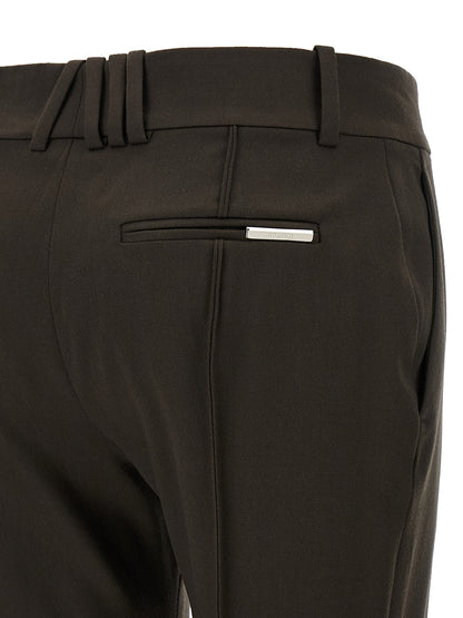 Trousers by The Attico for women in virgin wool brown presents a perennial silhouette, meticulously tailored with a flared cut, long finish, and an elegant .