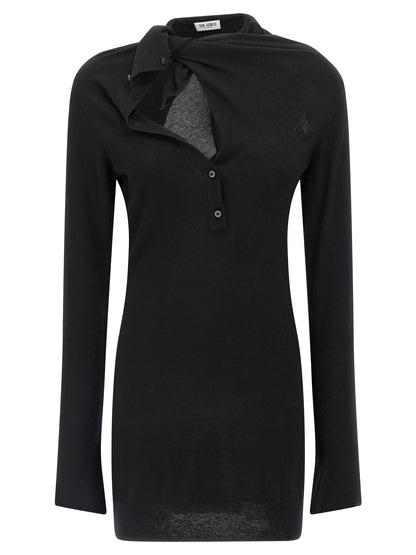 Dress by The Attico for women in cashmere virgin wool black presents a sinuous silhouette, showcasing a sophisticated shawl-collar neckline and detailed with a sinuous short mini for a refined finish.