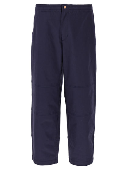 Trousers by MONCLER GENIUS for men in stretch cotton blue features a sculptural silhouette, showcasing a sculptural straight-leg & wide and long with a sophisticated for a sculptural finish.