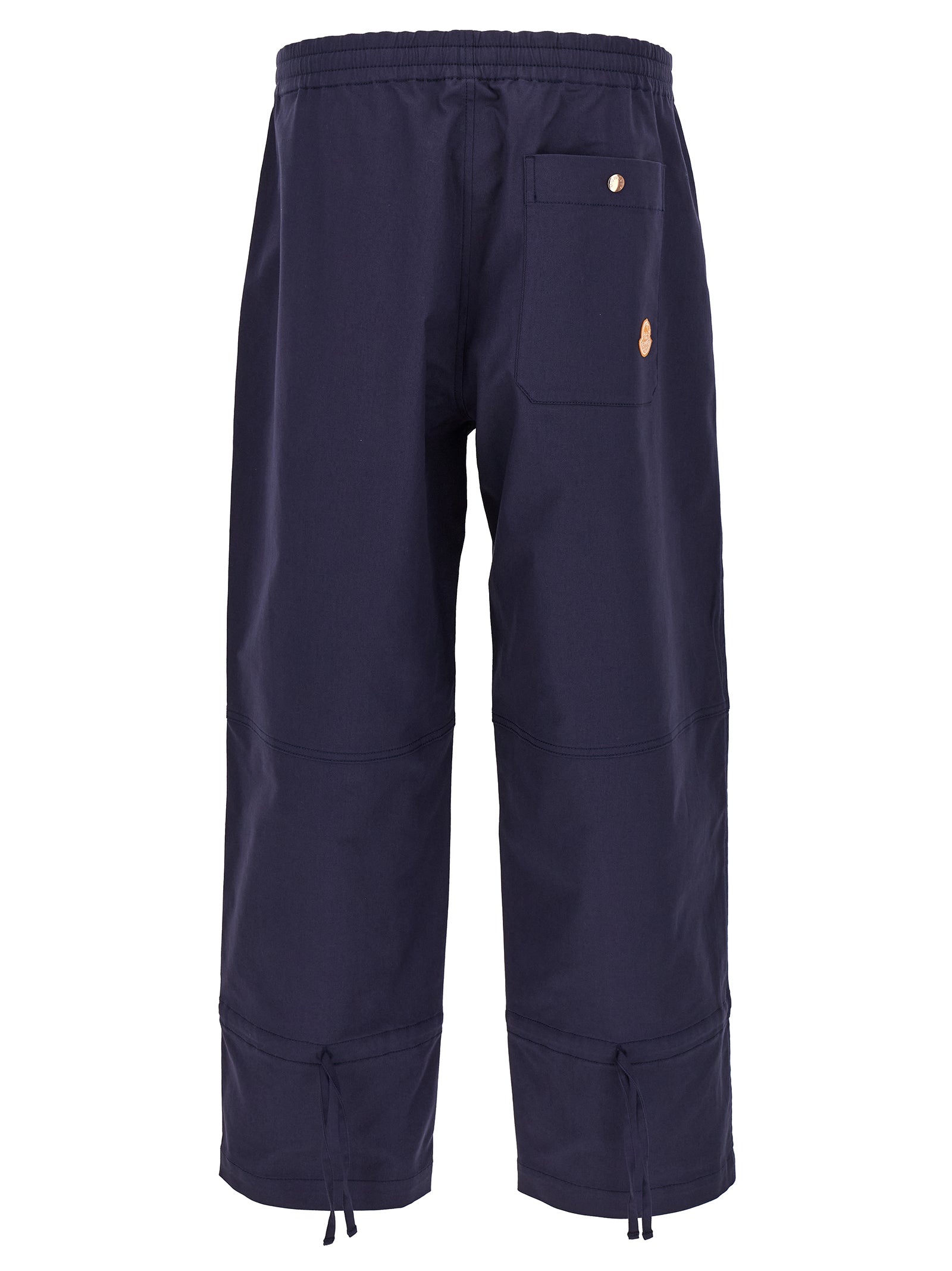 Trousers by MONCLER GENIUS for men in stretch cotton blue features a tailored silhouette with a tailored straight-leg & wide, defined by its long and a sophisticated .