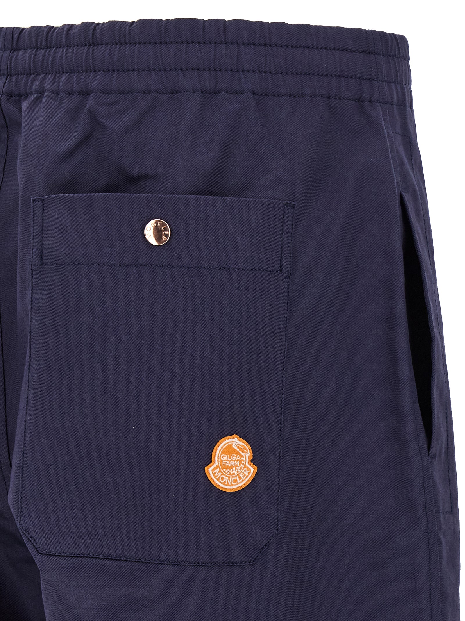 Trousers by MONCLER GENIUS for men in stretch cotton blue presents a smart silhouette, meticulously detailed with a smart straight-leg & wide, a smart long, and a smart .