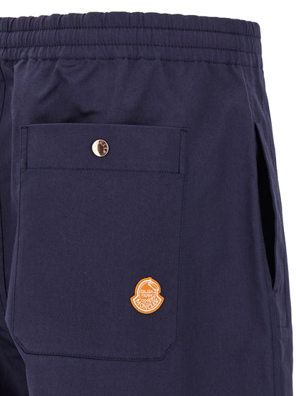 Trousers by MONCLER GENIUS for men in stretch cotton blue presents a smart silhouette, meticulously detailed with a smart straight-leg & wide, a smart long, and a smart .