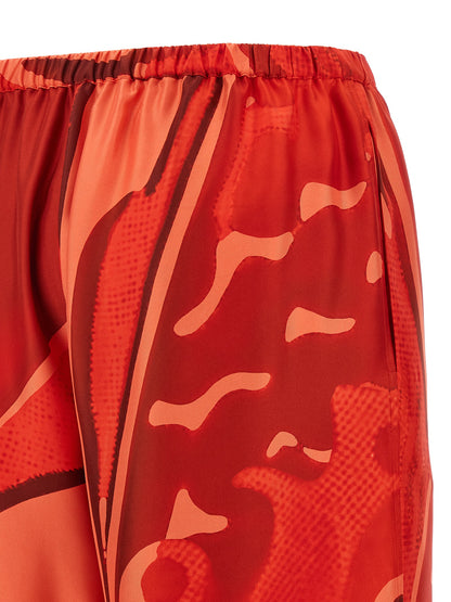Palazzo Pants by Ferragamo for women in silk multicolor, red & print features a polished silhouette with a polished relaxed-fit & wide, reaching a polished long and finished with a polished .