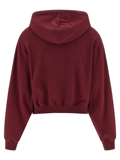 Sweatshirt Hoodie by ROTATE BIRGER CHRISTENSEN for women in cotton terry cloth bordeaux features a slouchy chic silhouette, detailed with a slouchy chic and a signature hooded neckline for an elevated aesthetic.