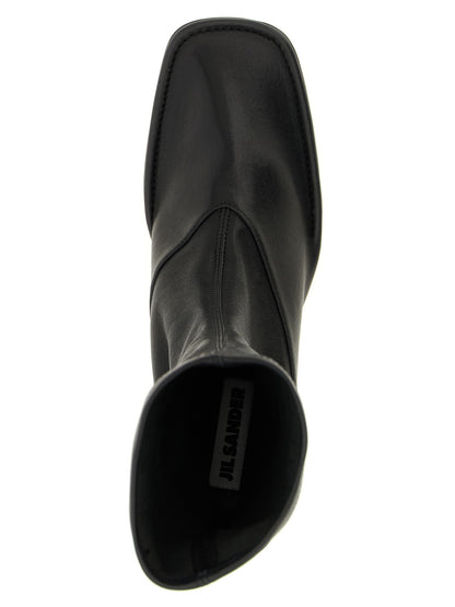 Ankle Boots by Jil Sander for women in nappa lamb leather black features an dynamic silhouette, showcasing the dynamic Women's Nappa Lamb Leather Ankle Boots design with its distinctive and elegant square toe style.