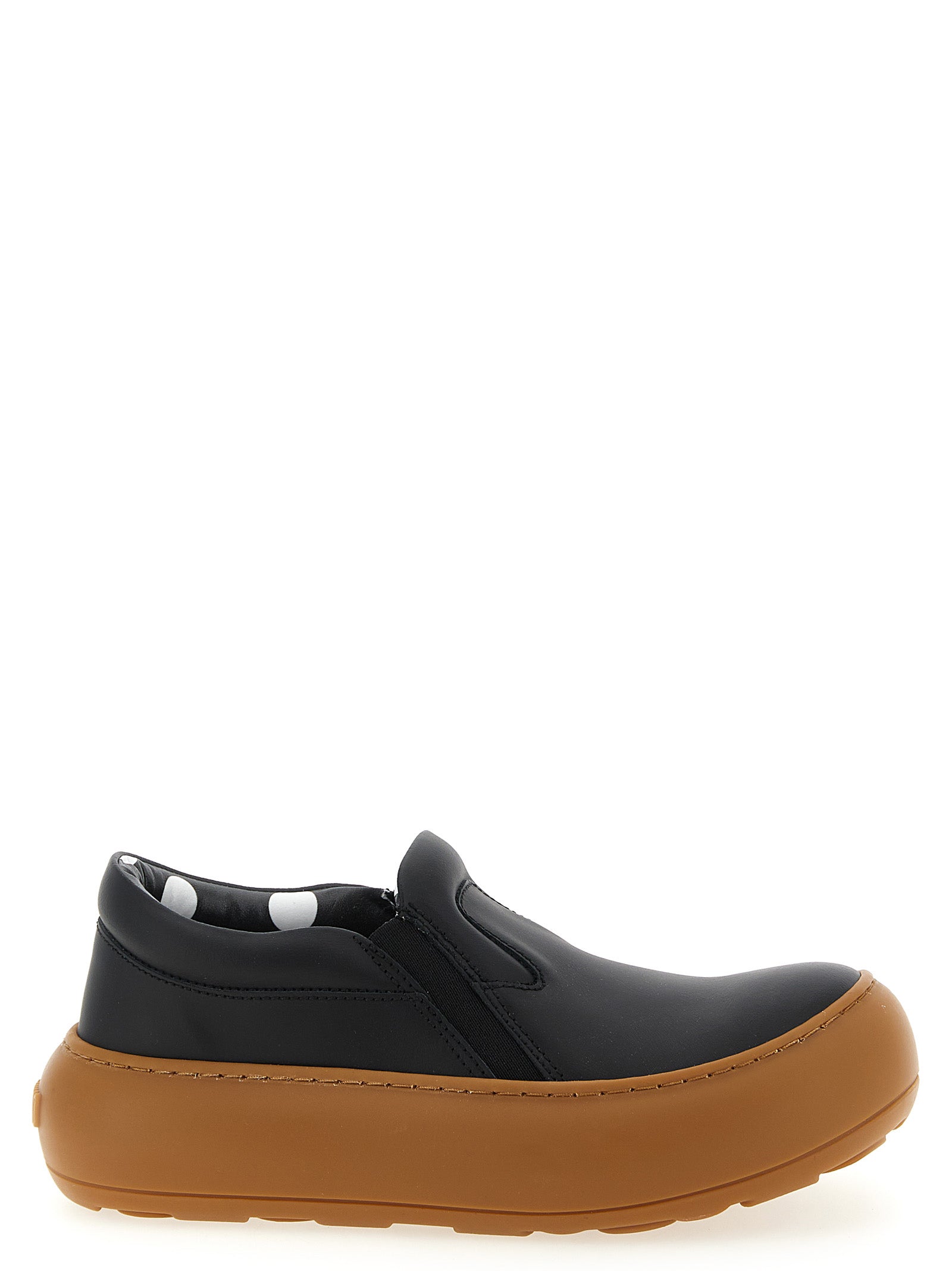 Sneakers by Moschino for women in leather & rubber black & print presents a sumptuous silhouette, artfully capturing the essence of the Ollie Women's Slip On Chunky Leather & Rubber Sneakers with its sumptuous slip-on chunky style design.