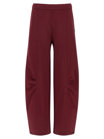 Joggers by ROTATE BIRGER CHRISTENSEN for women in organic cotton terrycloth bordeaux presents a tailored silhouette, showcasing a tailored straight-leg and long cut with a refined high rise for a truly tailored aesthetic.