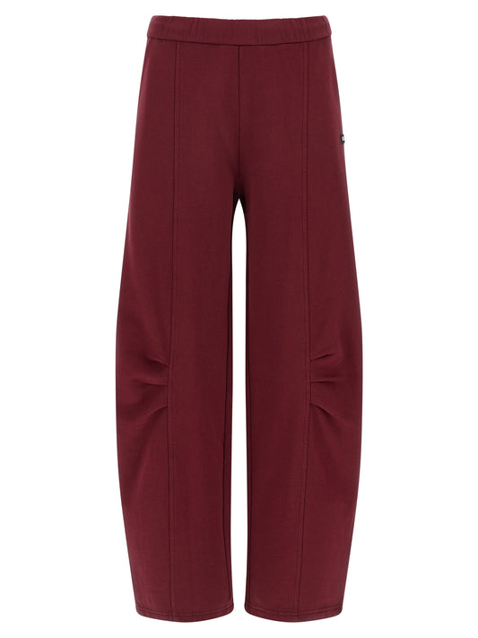 Joggers by ROTATE BIRGER CHRISTENSEN for women in organic cotton terrycloth bordeaux presents a tailored silhouette, showcasing a tailored straight-leg and long cut with a refined high rise for a truly tailored aesthetic.
