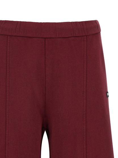 Joggers by ROTATE BIRGER CHRISTENSEN for women in organic cotton terrycloth bordeaux features an sophisticated high rise and straight-leg with a precise long, creating a sophisticated and sophisticated silhouette.