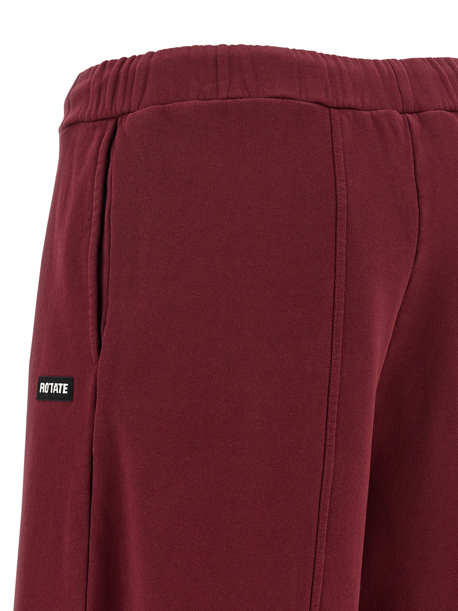 Joggers by ROTATE BIRGER CHRISTENSEN for women in organic cotton terrycloth bordeaux presents a tailored silhouette, showcasing a tailored straight-leg and long cut with a refined high rise for a truly tailored aesthetic.