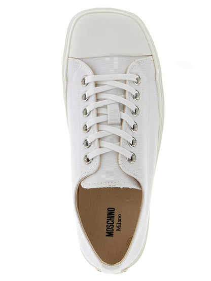 Sneakers by Moschino for men in cotton & rubber white presents a sumptuous silhouette, artfully capturing the essence of the Men's Low Top Cotton & Rubber Sneakers with its sumptuous low-top style design.