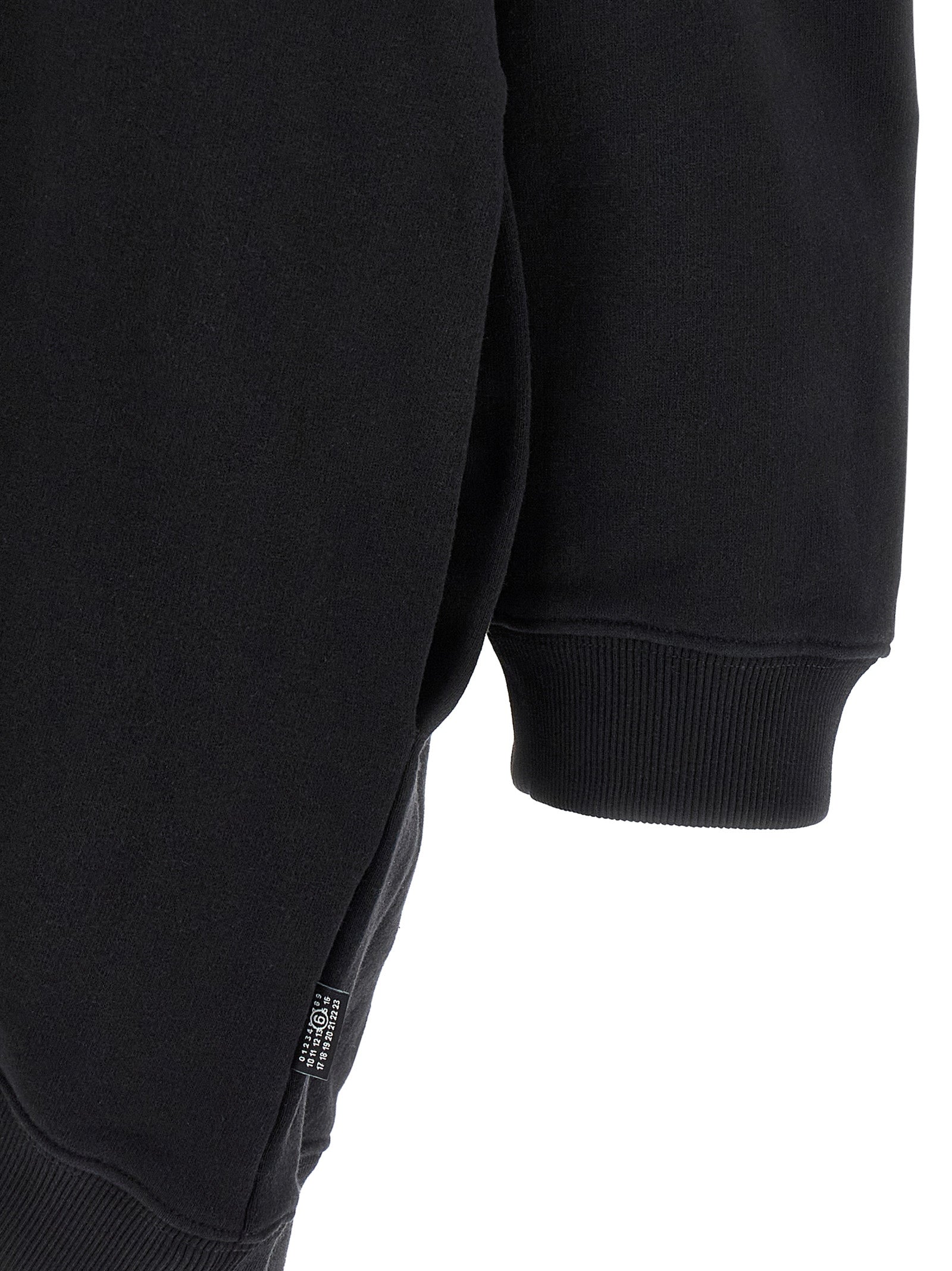 Hooded Dress by MM6 Maison Margiela for women in cotton black, white & signature features a dramatic silhouette, showcasing an elegant and that flows into a dramatic short mini.