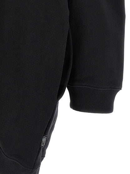 Hooded Dress by MM6 Maison Margiela for women in cotton black, white & signature features a dramatic silhouette, showcasing an elegant and that flows into a dramatic short mini.