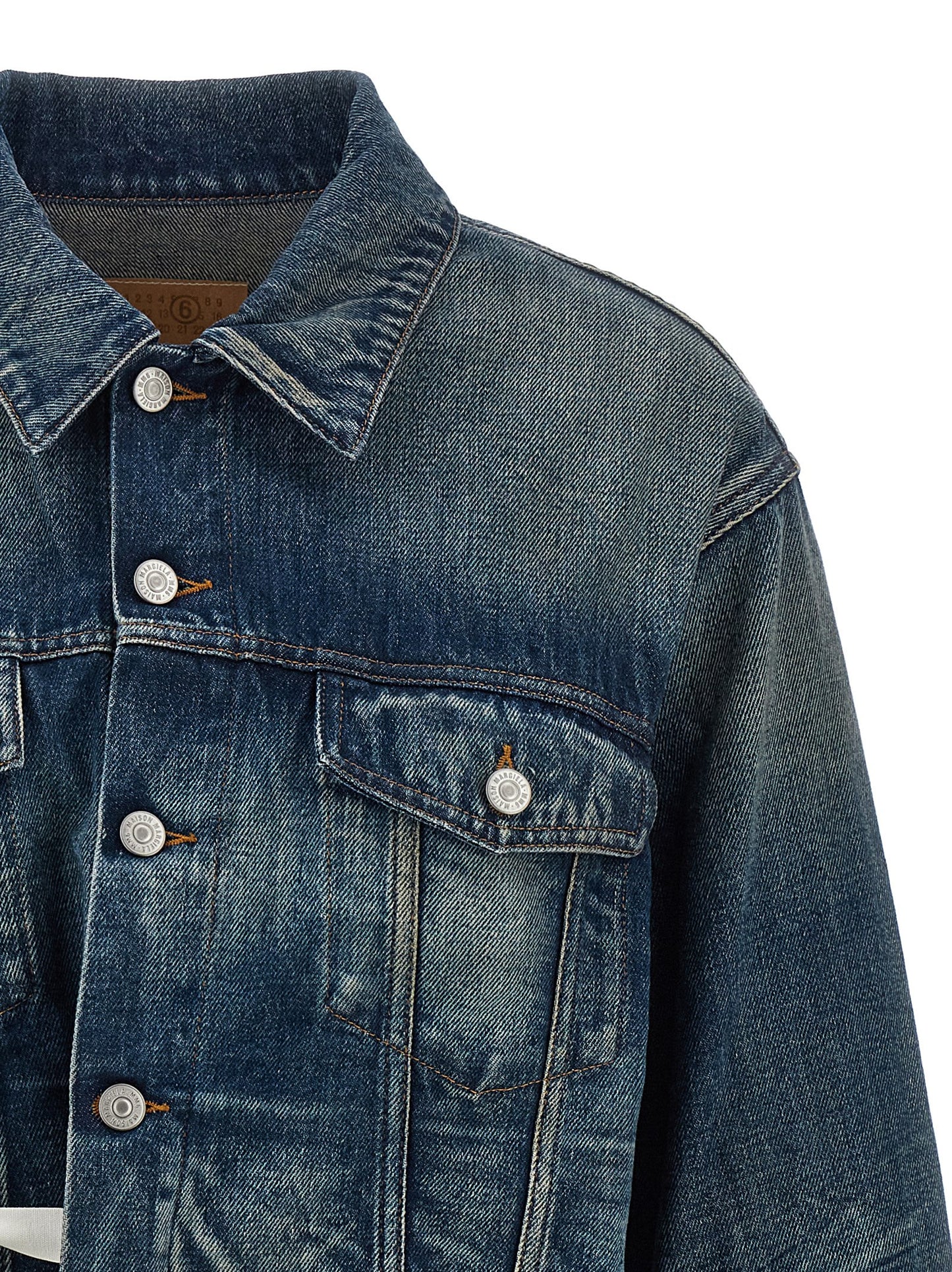 Trucker Jacket by MM6 Maison Margiela for women in denim cotton blue features a city-ready silhouette, detailed with pockets and a city-ready asymmetric shirt-collar neckline.