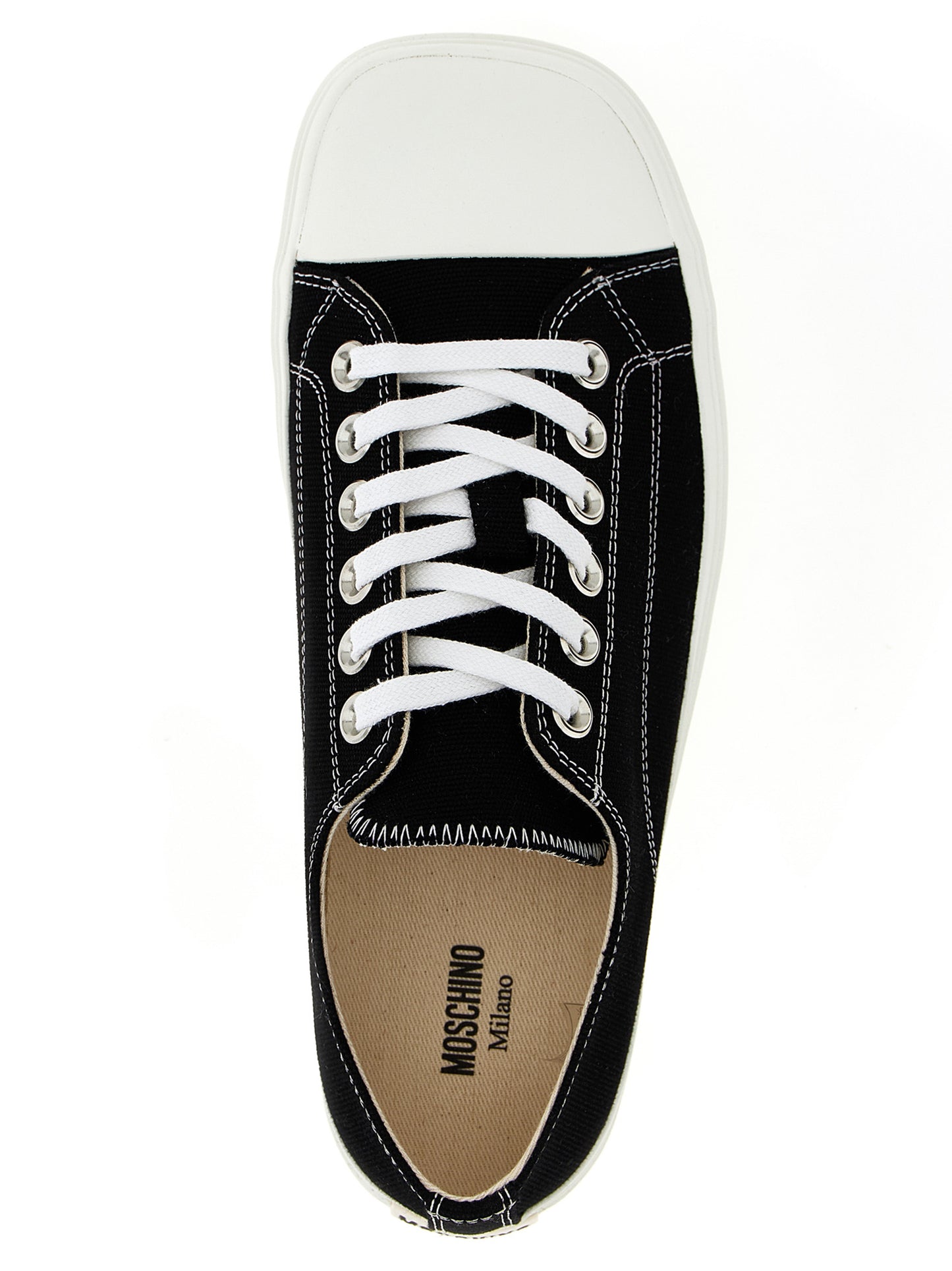 Sneakers by Moschino for men in cotton canvas bicolour, black & white presents a sumptuous silhouette, artfully capturing the essence of the Men's Fashion Cotton Canvas Sneakers with its sumptuous fashion style design.