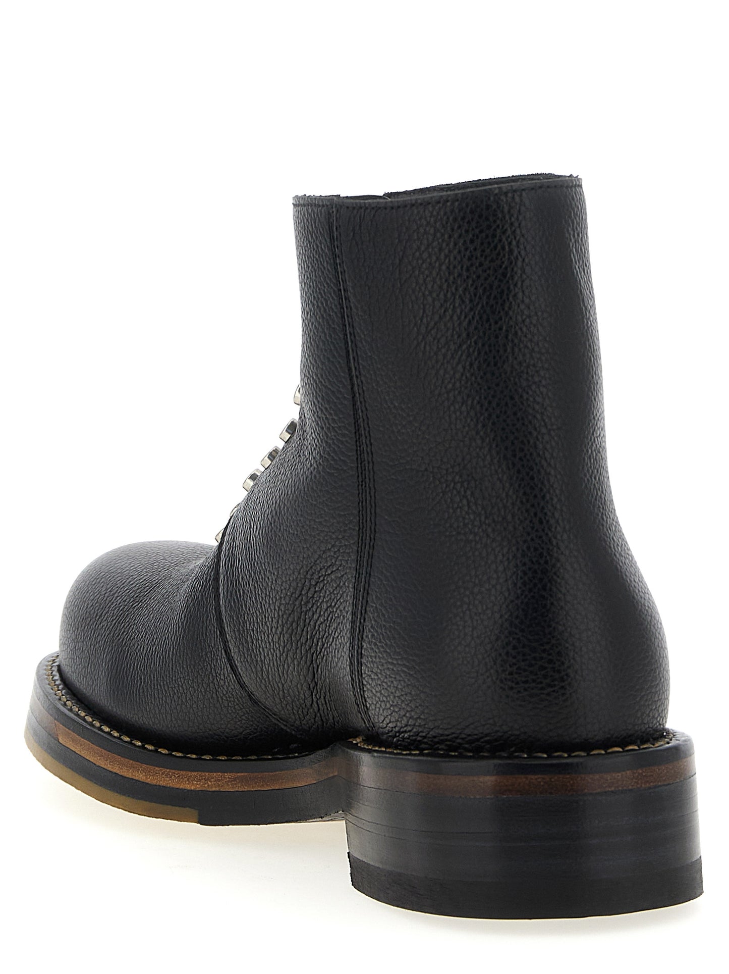 Ankle Boots by Alexander McQueen for men in calfskin leather black showcases a ergonomic silhouette from the Men's Calfskin Leather Ankle Boots collection, featuring a ergonomic and a ergonomic .