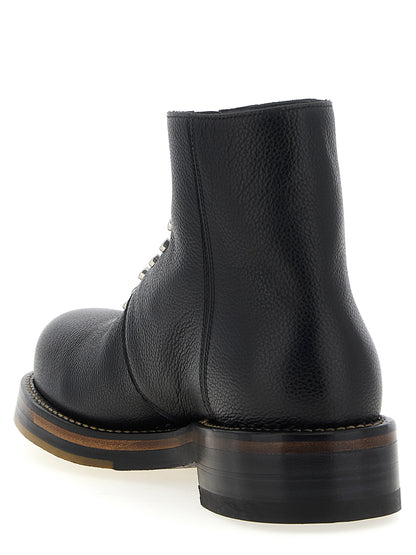 Ankle Boots by Alexander McQueen for men in calfskin leather black showcases a ergonomic silhouette from the Men's Calfskin Leather Ankle Boots collection, featuring a ergonomic and a ergonomic .