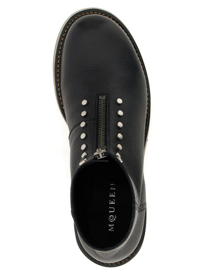 Ankle Boots by Alexander McQueen for men in calfskin leather black features an effortless chic silhouette from the Men's Calfskin Leather Ankle Boots collection, showcasing a effortless chic and refined for an effortless chic look.